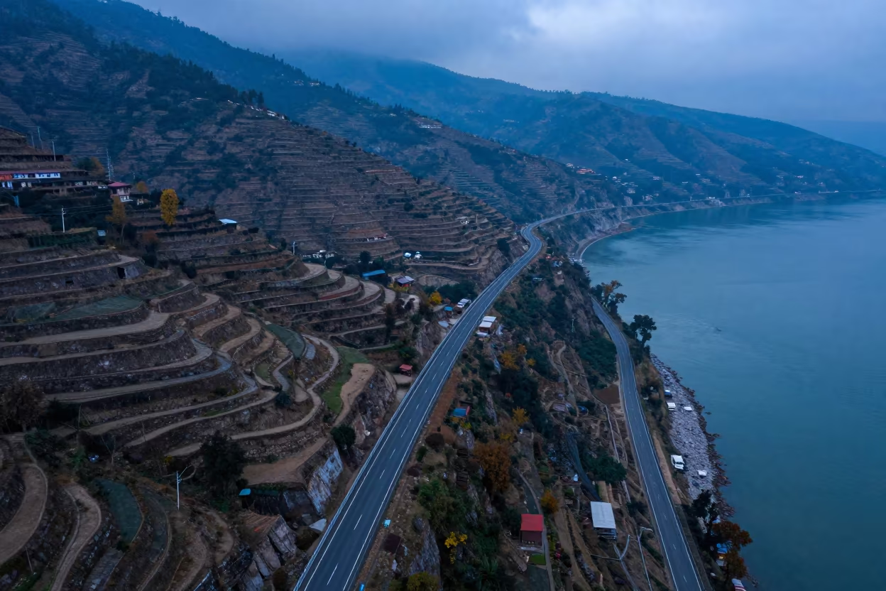 Misty Coastal Highway Cliff Edge Twilight Aerial View in far above terraced hillsides near Pokhara