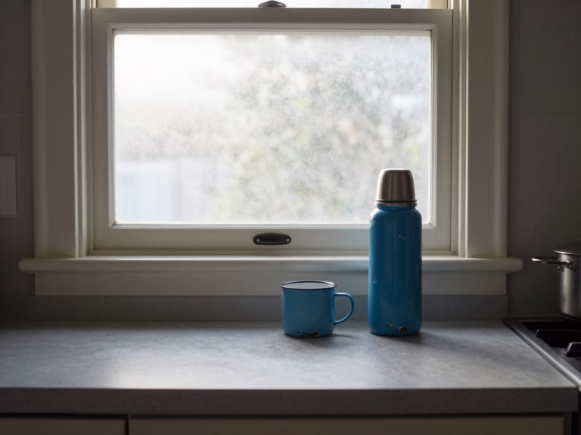 Misty Dawn Auckland Kitchen Chipped Blue Enamel Thermos and Tiled Floor in in Auckland, New Zealand