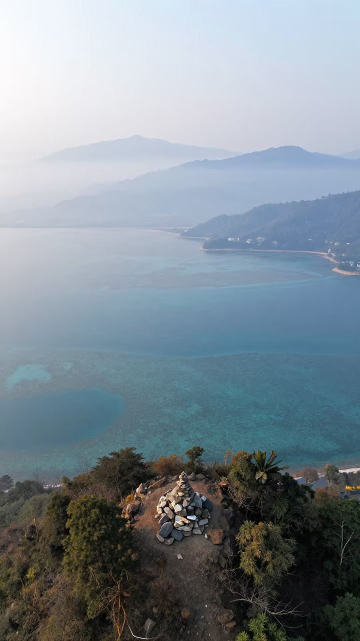 Misty Dawn Over Barrier Reef Near Kathmandu Summit in beside a summit cairn above the tree line near Kathmandu