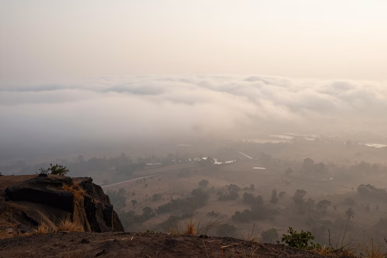 Misty Dawn Clouds Over Mumbai Floodplain in across a floodplain after rain near Mumbai
