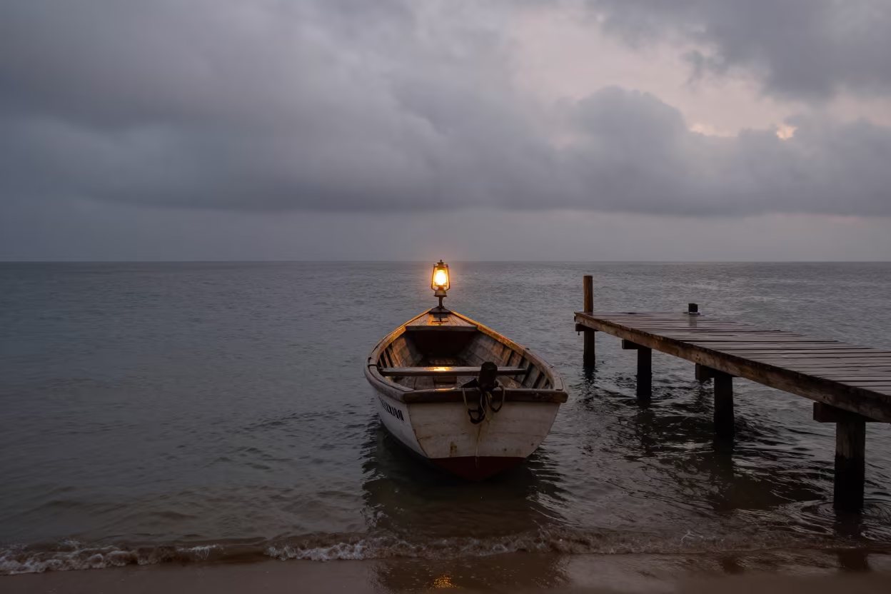 Mombasa Fishing Boat Lantern Dawn Mist in beside a wooden harbor jetty near Mombasa