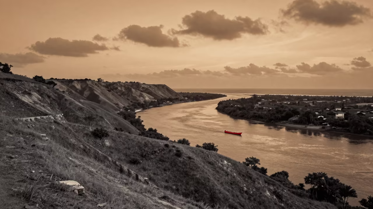 Monochrome Estuary with One Vivid Object in from a ridge above layered foothills near Zanzibar City