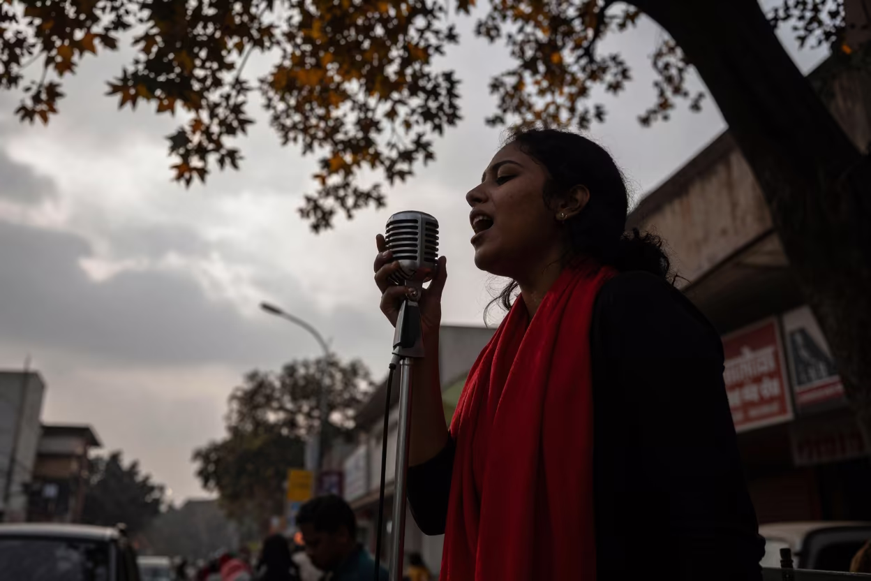 Monochrome Street Musician Red Scarf in at a street corner busking spot in Noida