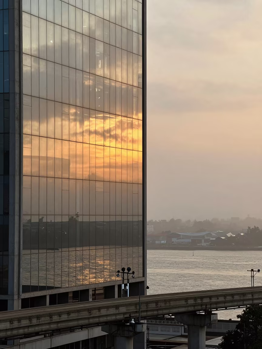 Monorail Reflection in Glass Skyscraper Benin Harbor in beside a fogbound harbor mouth in Benin