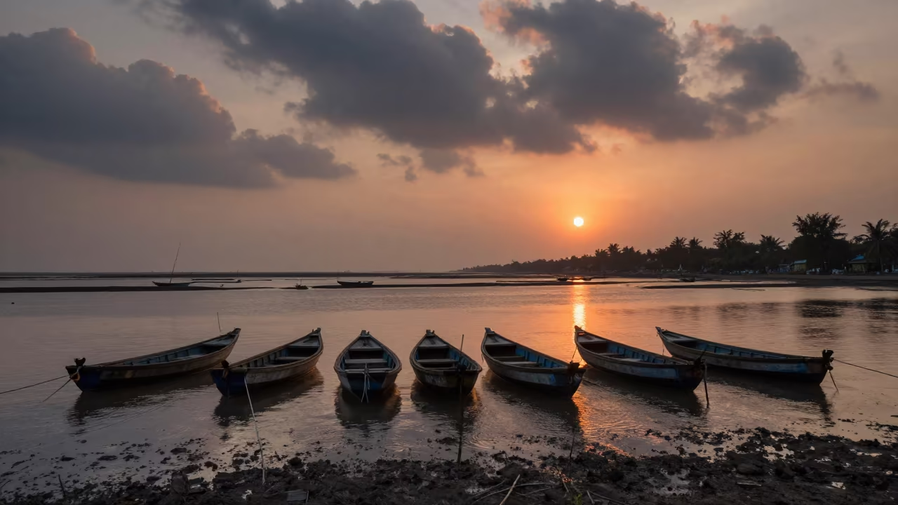 Monsoon Harbor Boats in Honeyed Evening Light in across a floodplain after rain near Mumbai
