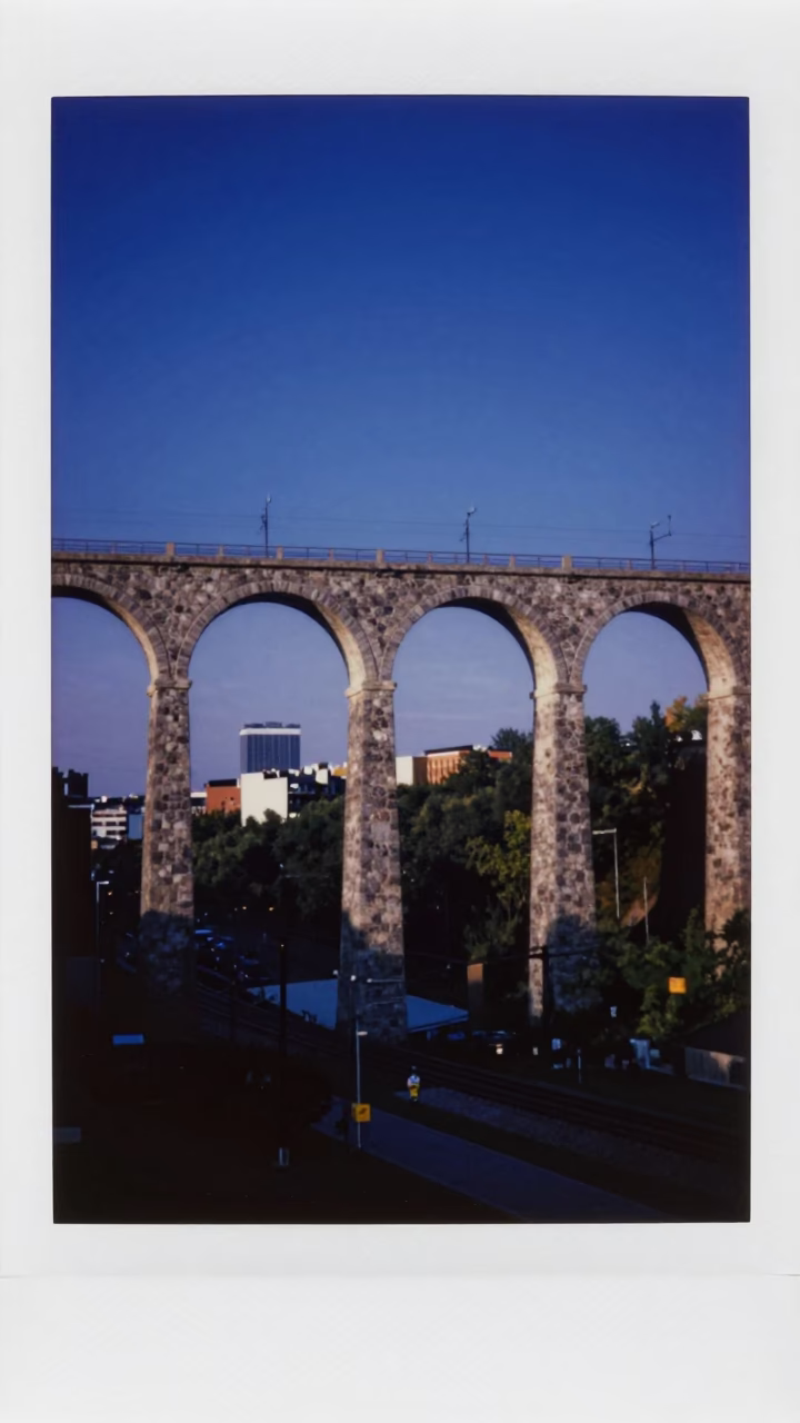 Montreal Blue Hour Railway Viaduct Arches Over Urban Valley in in Montreal, Quebec, Canada