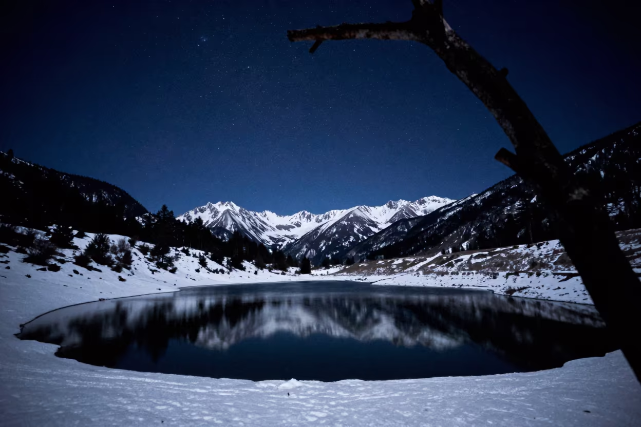 Moonlit Alpine Lake Reflecting Stars Over Yunnan Snowfields in beneath a hard winter sky over snowfields in Yunnan