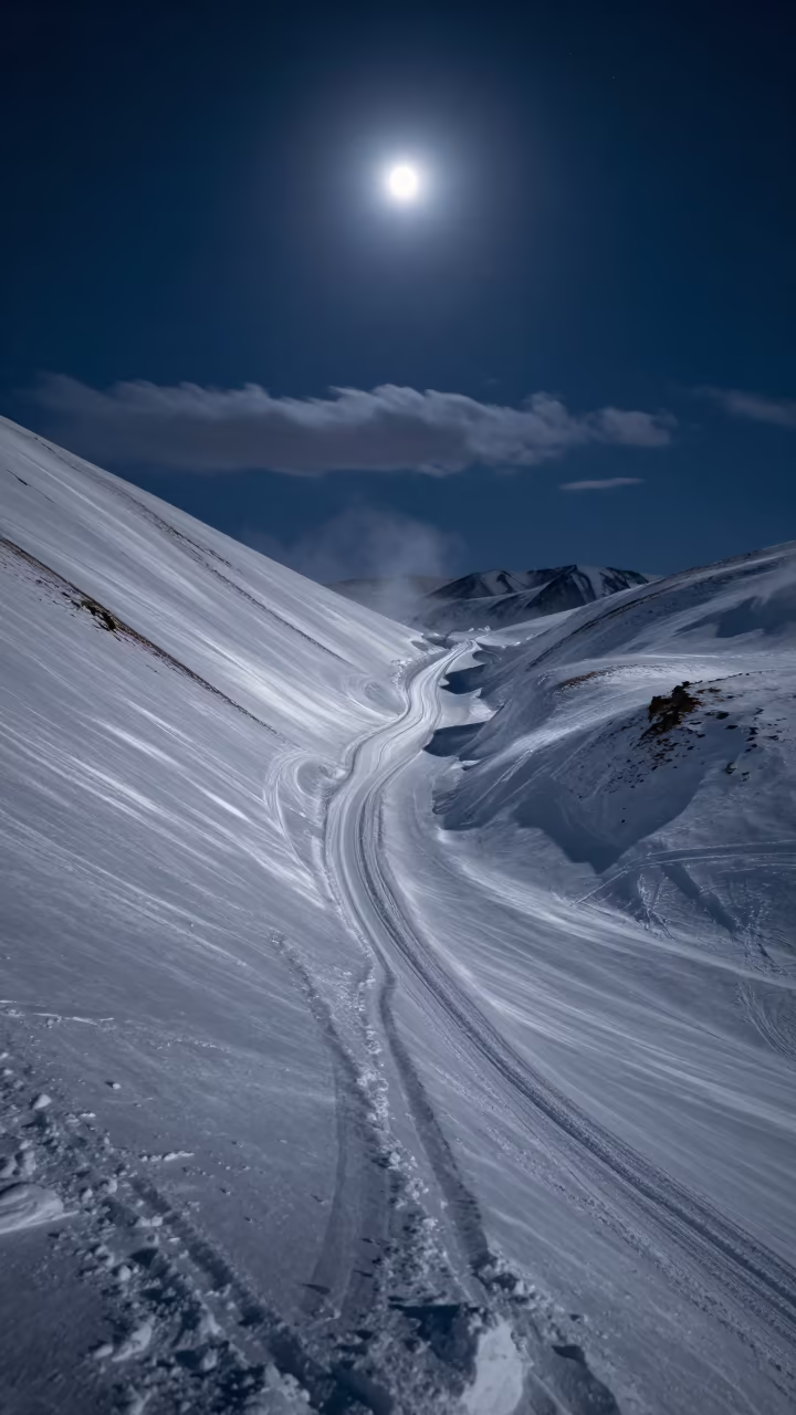Moonlit Avalanche Chute in Mongolian Night in beneath thin cloud gaps and stars in Mongolia