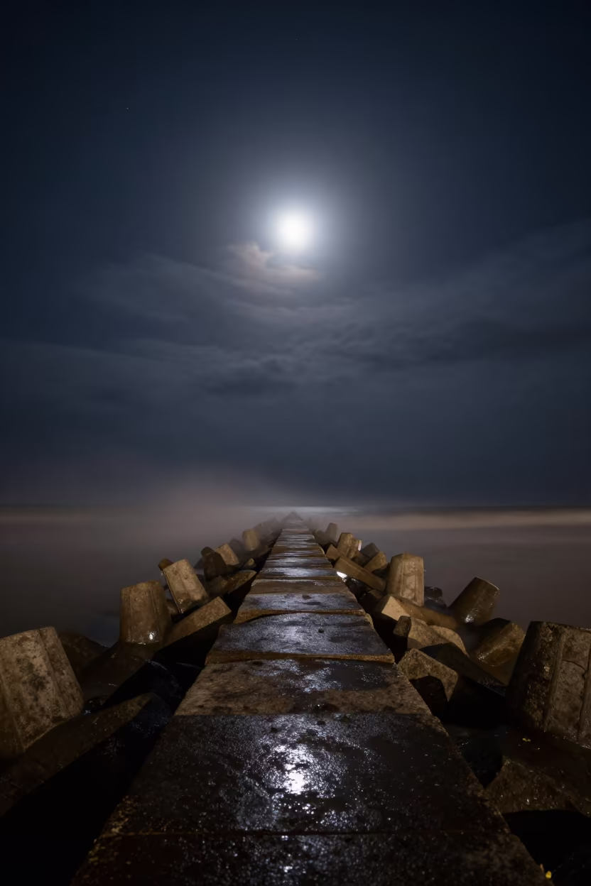 Moonlit Cloud Trails Over Karnataka Breakwater in from a moonlit breakwater in Karnataka