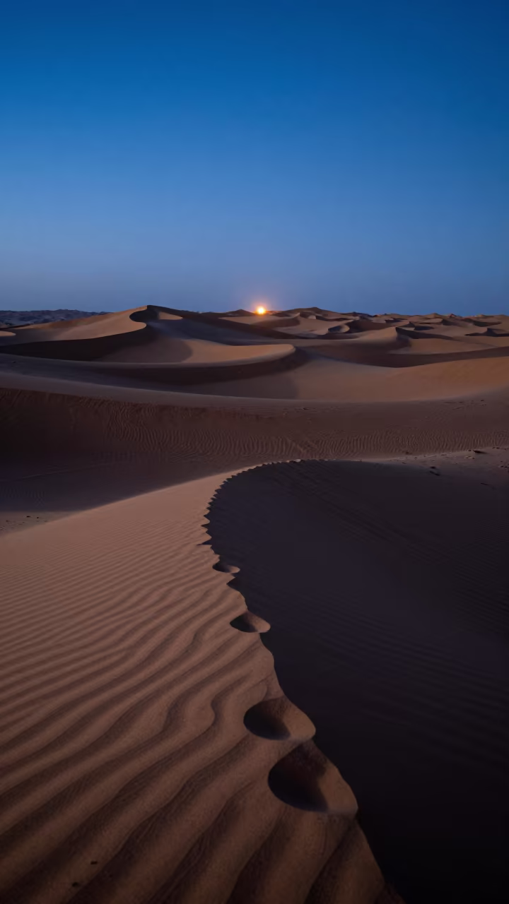 Moonlit Dunes Cast Blue Shadows Dubai Night in from a dune-backed overlook in clear desert air near Al Fahidi, Dubai