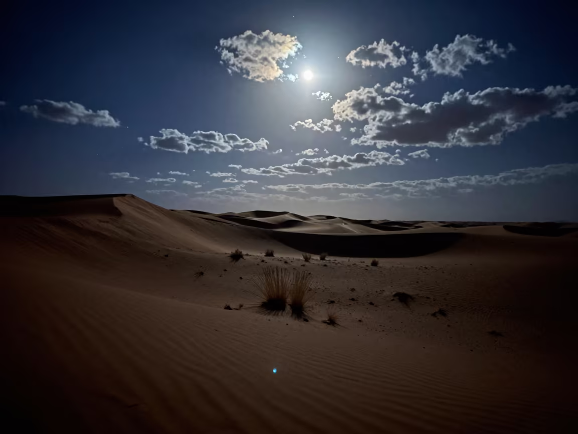 Moonlit Dunes and Stars Near Nouakchott in beneath thin cloud gaps and stars near Nouakchott