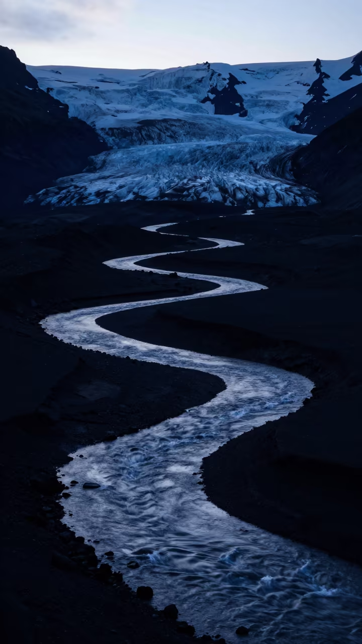 Moonlit Glacier River Through Volcanic Sand Valley in across a wide valley floor in Tyrol