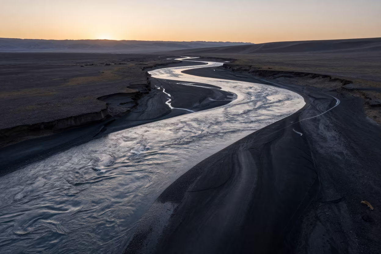 Moonlit Glacier River Winding Through Volcanic Sand in across a floodplain after rain near Lhasa
