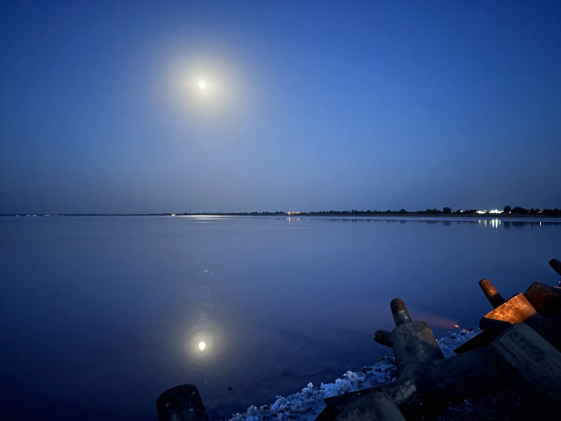 Moonlit Salt Flat Reflection Twilight Delhi in from a moonlit breakwater near Delhi