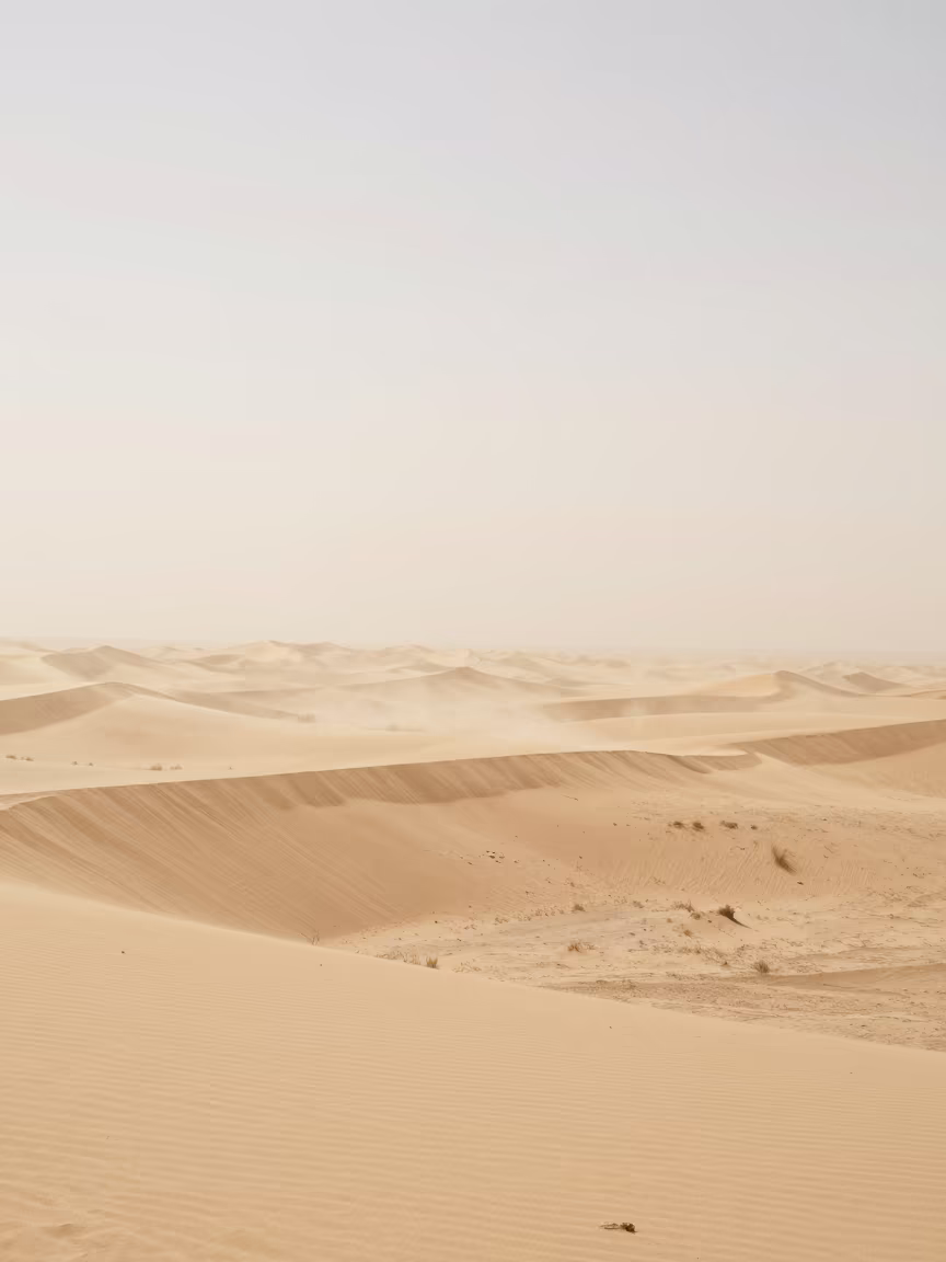 Moonlit Sandstorm Veiling Stars Over Dunes in beneath fast-moving cloud bands in New Mexico