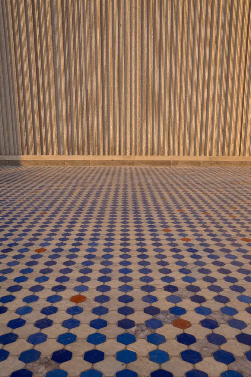 Moorish Mosaic Floor in Amber Khemisset Light in inside a ribbed concrete lobby in Khemisset