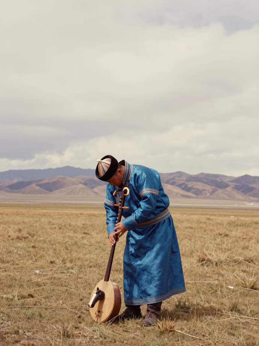 Morin Khuur Player Under Oregon Valley Sky in across a wide valley floor in Oregon