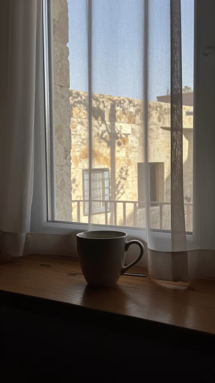 Morning Coffee Cup on Irbid Window Seat at Dawn in on a window seat in Irbid