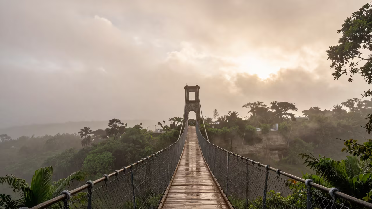 Morning Fog Over Suspension Bridge Guatemala in beneath fast-moving cloud bands in Guatemala