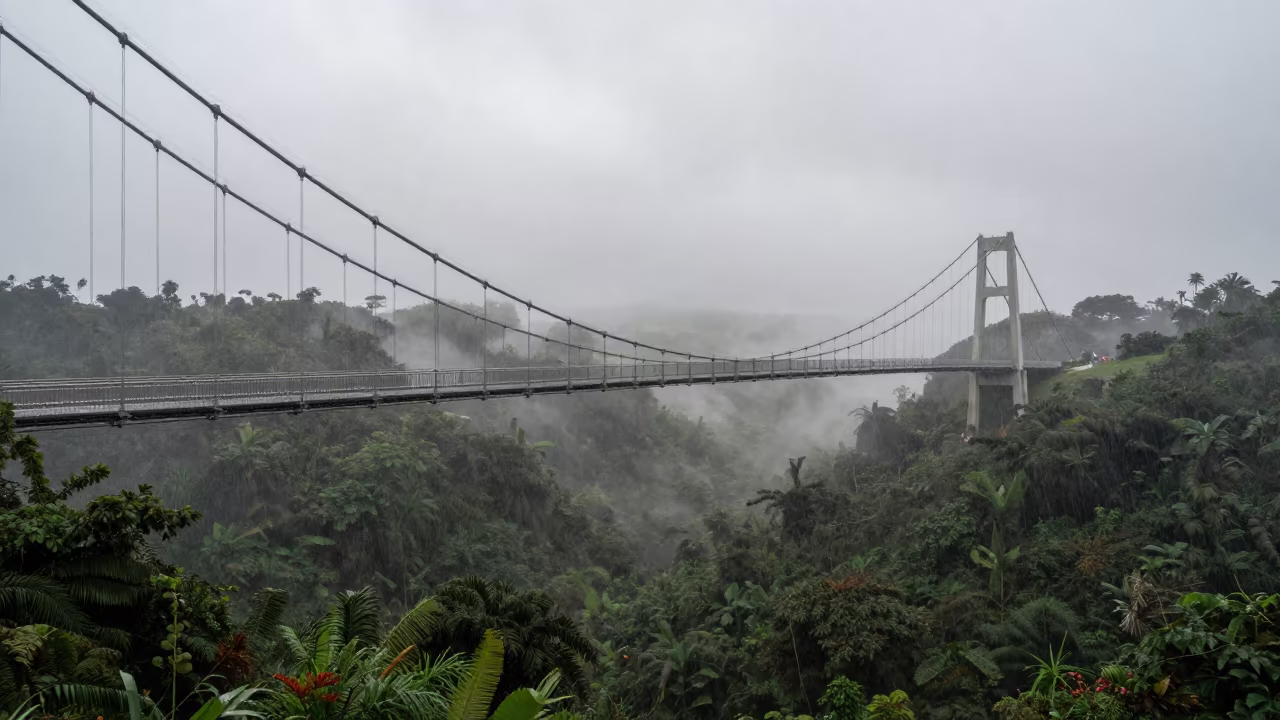 Morning Fog Over Suspension Bridge Santo Domingo in beneath fast-moving cloud bands near Santo Domingo