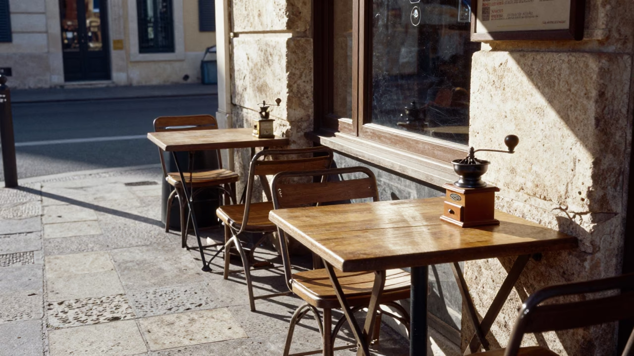Morning light hits Marseille street cafe with coffee grinder and glass tumblers in in Marseille, France