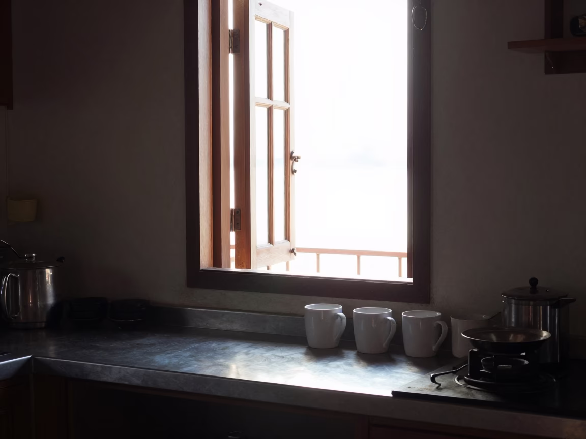Morning Light in a Phuket Thai Kitchen with Coffee Mugs and Pigeons in in Phuket, Thailand