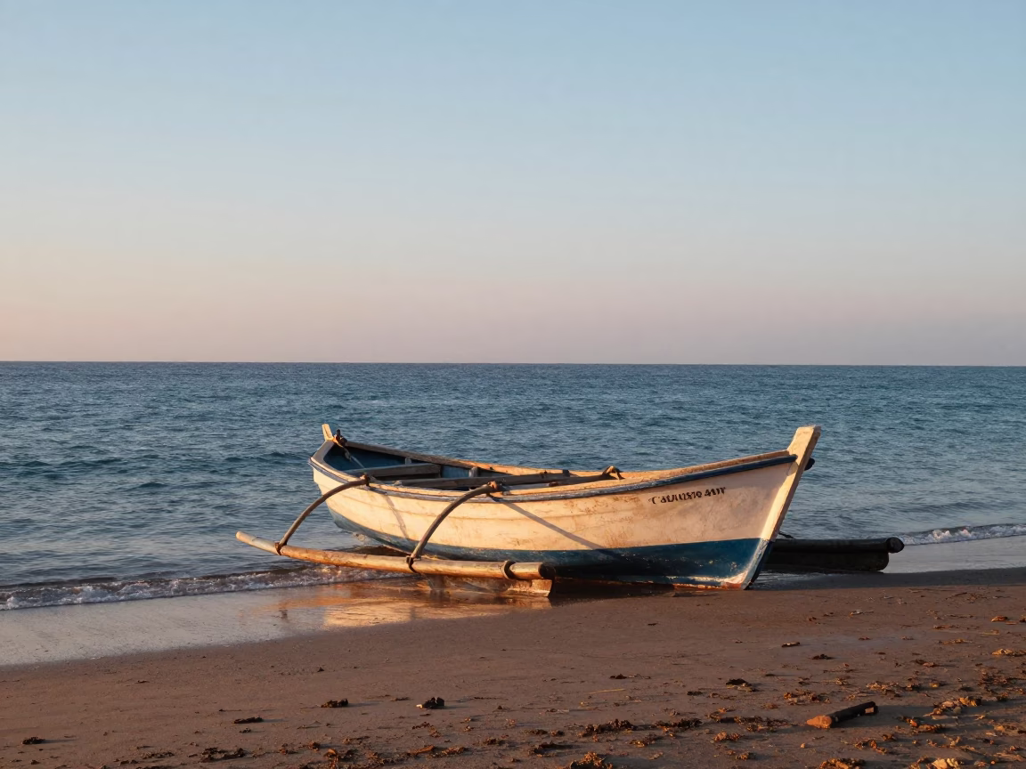 Morning light on Alexandria Mediterranean coastline with fishing boat and harbor details in in Alexandria, Egypt