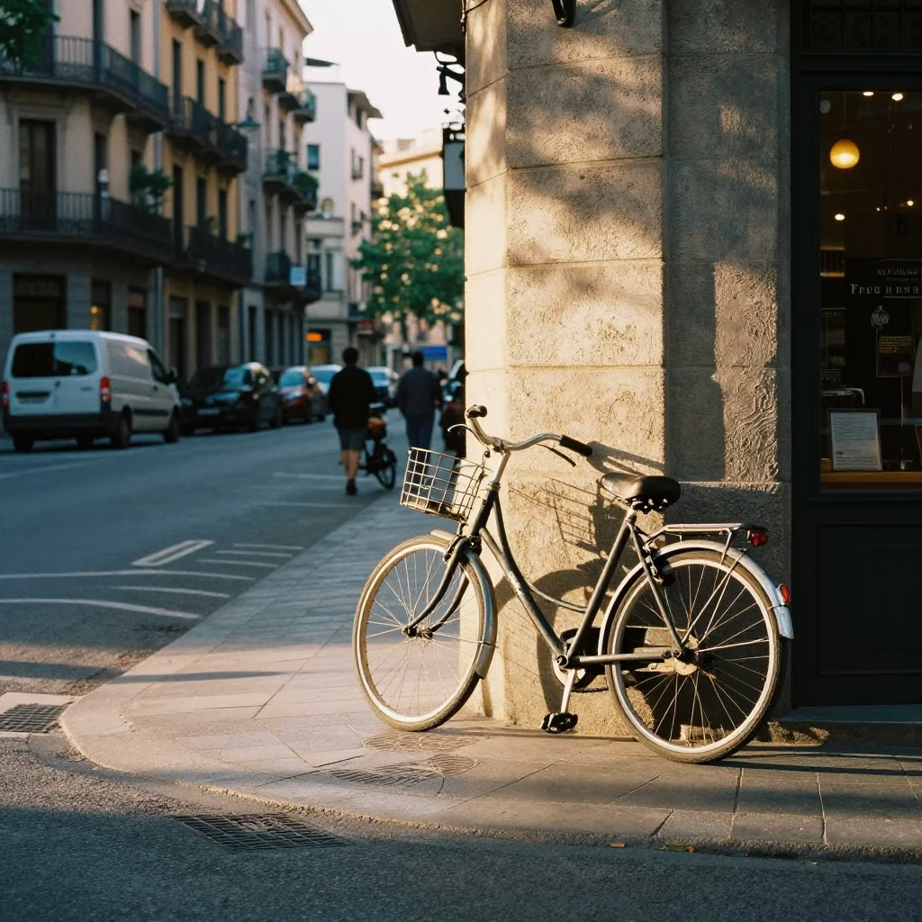Morning light on Barcelona street corner with vintage bicycle and glass storefront in in Barcelona, Spain