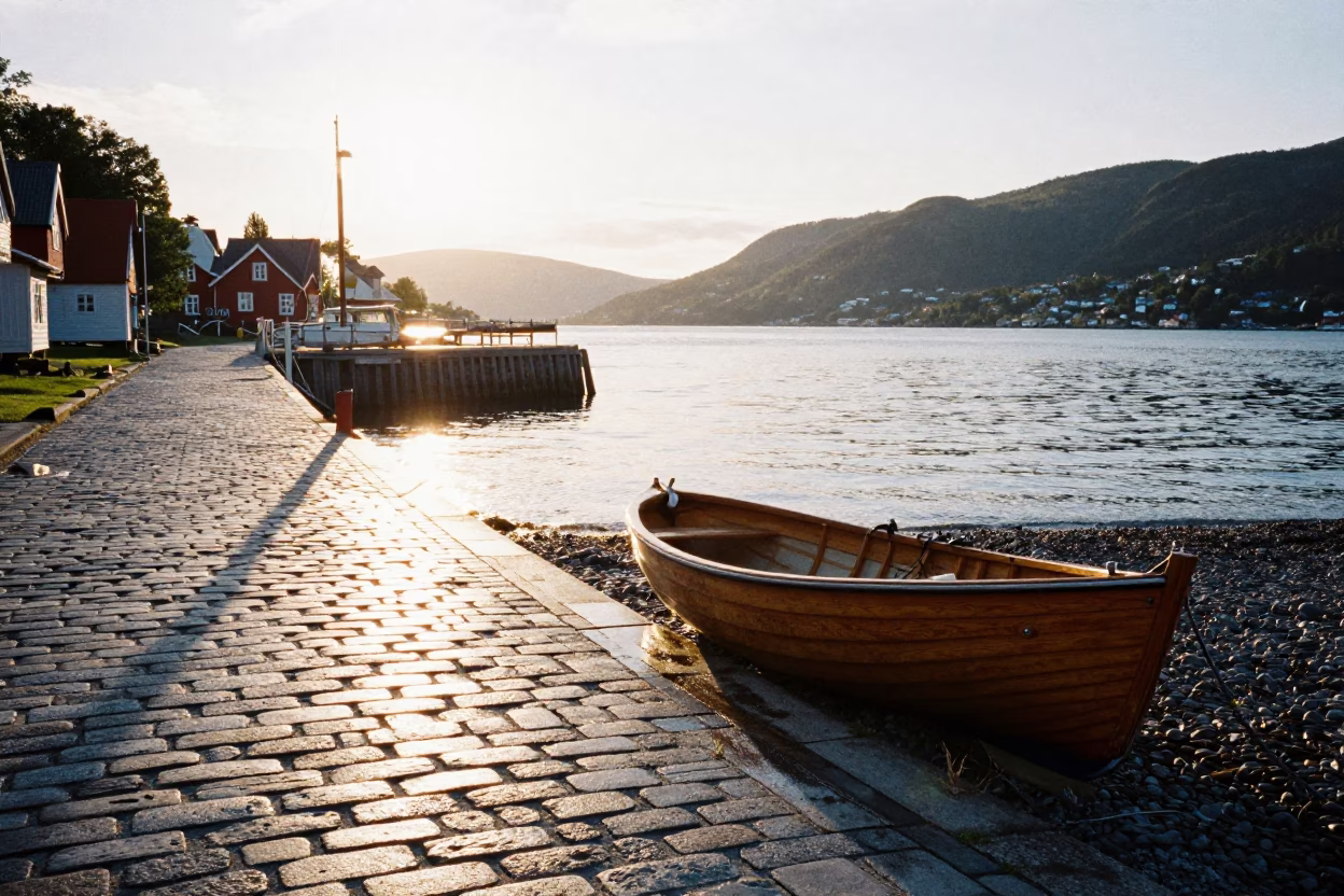 Morning Light on Bergen Norway Harbor Rowboat and Pepples Beach Cobblestones in in Bergen, Norway