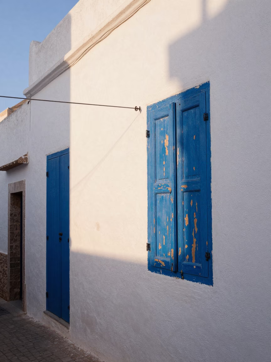 Morning Light on Blue Shutters and White Walls in Essaouira Morocco in in Essaouira, Morocco