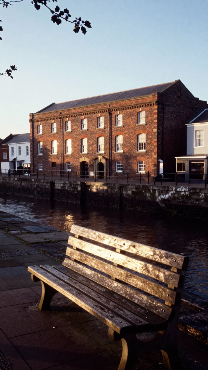Morning Light on Bristol Harbour Wharf with Leaf Shadows and Sun Stripe in in Bristol, United Kingdom