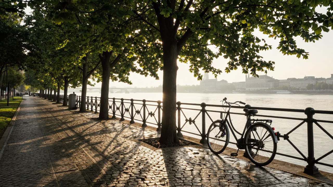 Morning Light on Budapest Danube Bank with Bicycle and Cobblestone Street Scene in in Budapest, Hungary