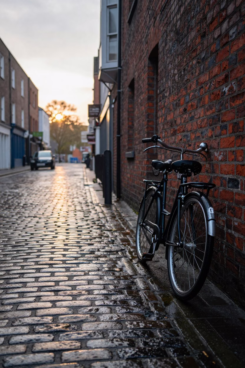 Morning Light on Dublin Cobblestones with Vintage Bicycle and Coffee Cup in in Dublin, Ireland