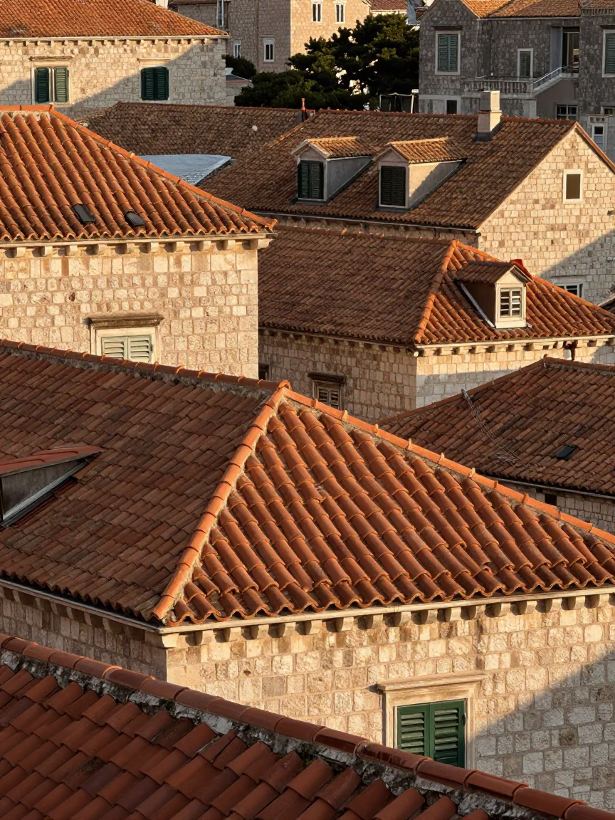 Morning light on historic Dubrovnik terracotta roof tiles and stone walls in in Dubrovnik, Croatia