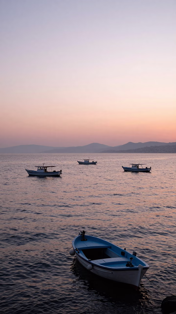 Morning Light on Izmir Bay with Traditional Fishing Boats and Coastal Activity in in Izmir, Turkey