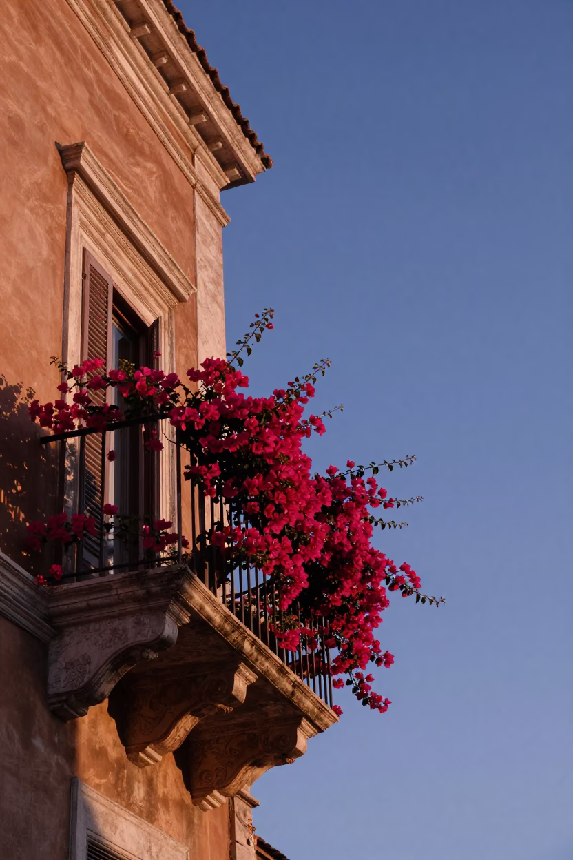 Morning light on Roman balcony with bougainvillea and fruit bowl at dawn in in Rome, Italy