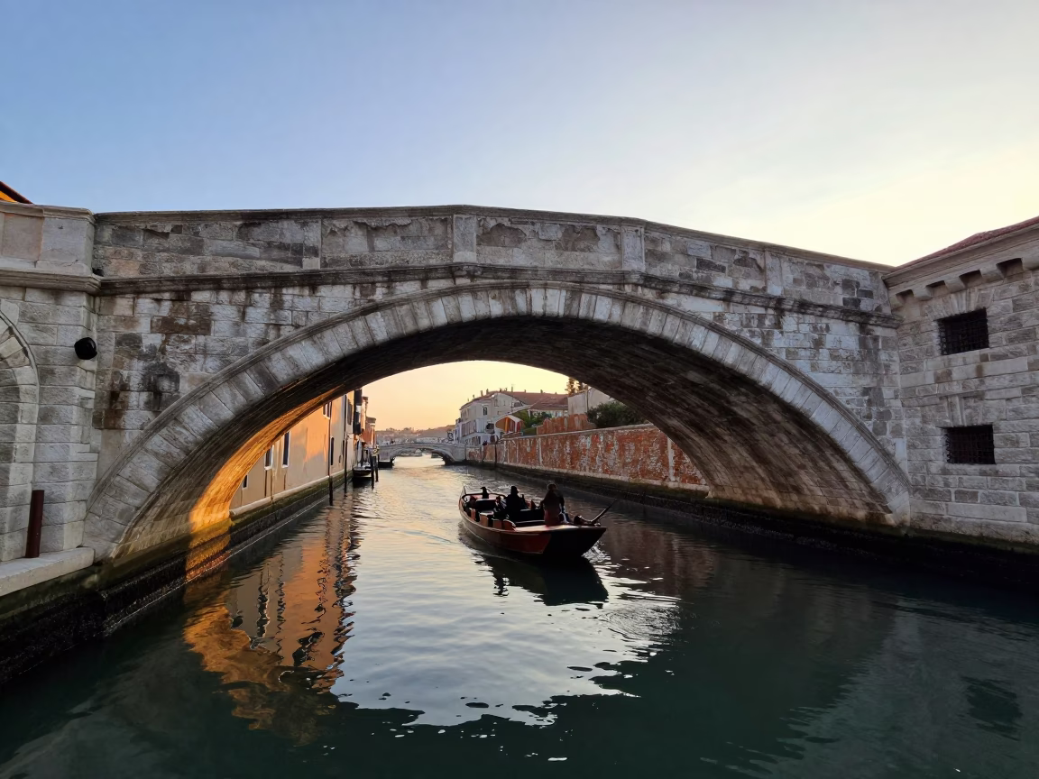 Morning Light on Roman Canal Bridge with Punt and Autumn Willows in in Rome, Italy