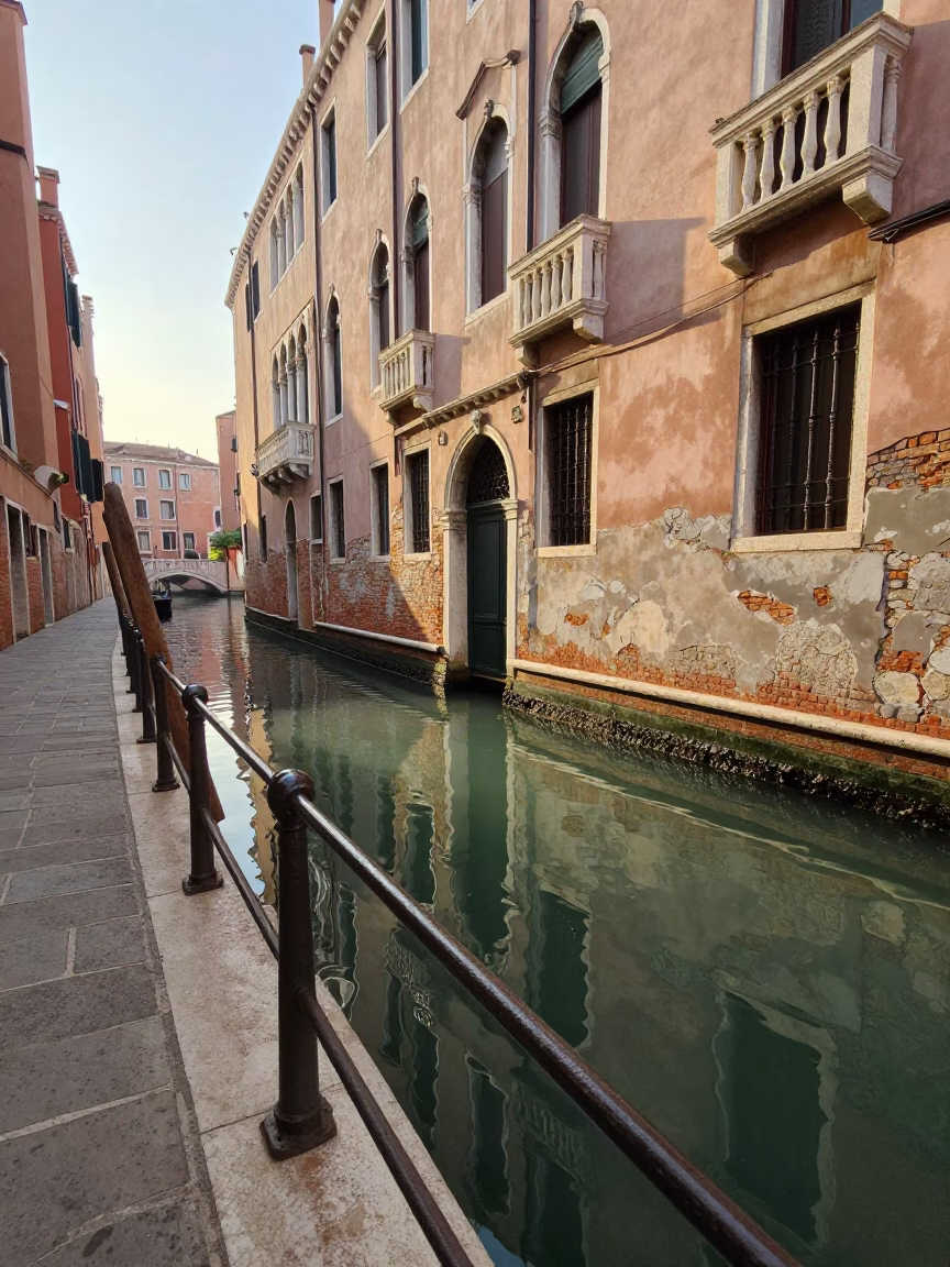 Morning Light on Venice Canal with Glass Carafe and Plaster Wall Shadow in in Venice, Italy