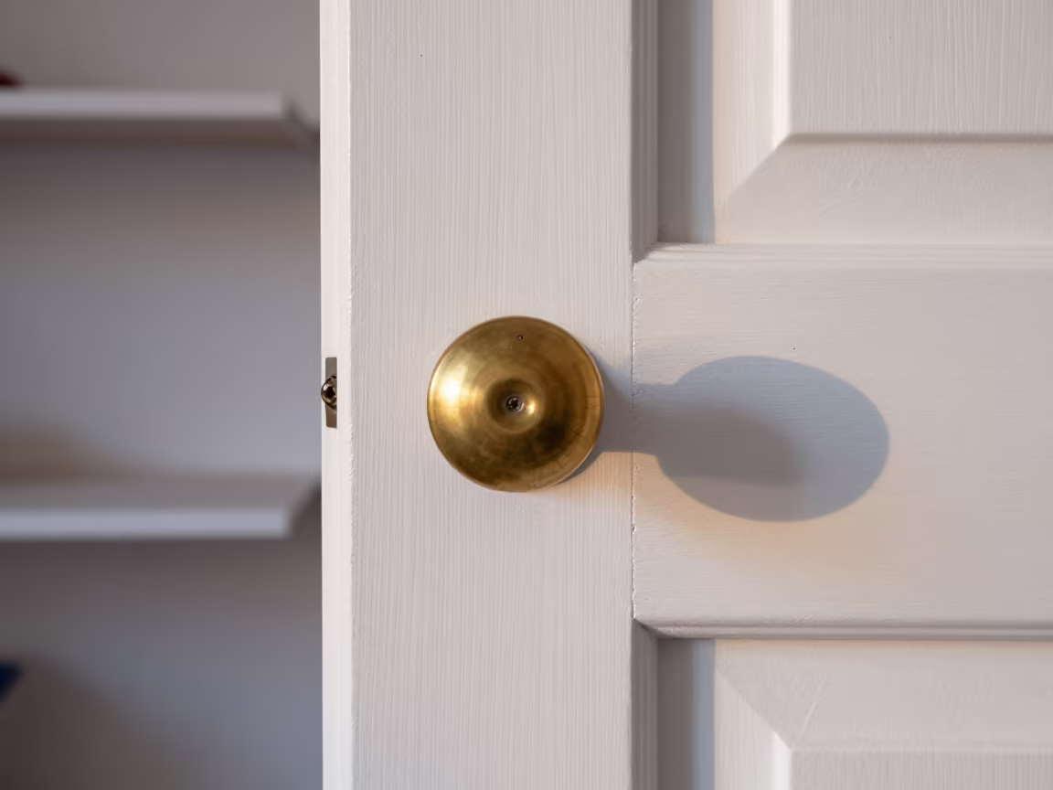 Morning Light on Worn Door Knob Shelf in on a workshop shelf in Helsinki