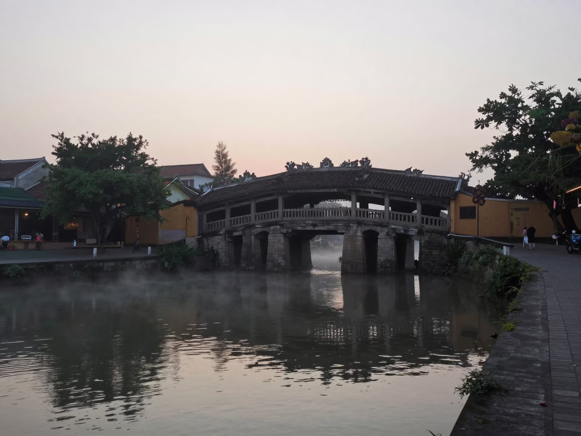 Morning Mist and River Activity at Hoi An Ancient Town Bridge Vietnam in in Hoi An, Vietnam