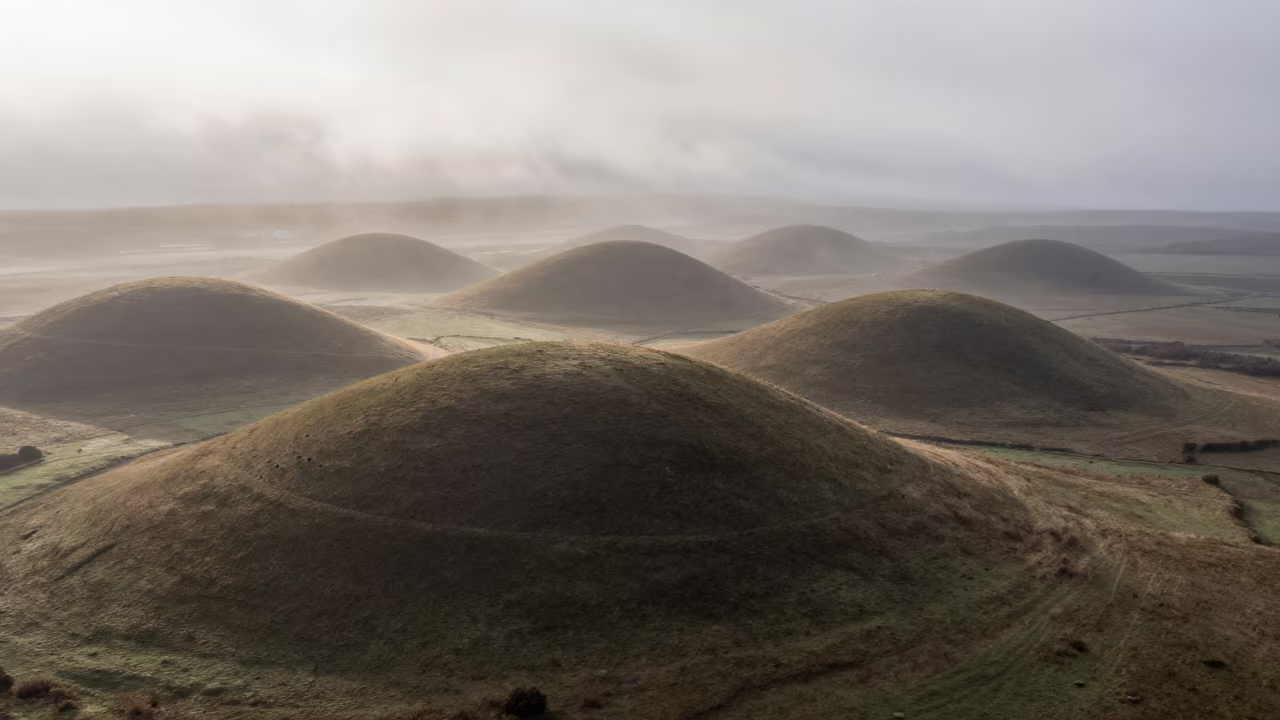 Morning Mist Over Drumlins Near Vitarte Ridge in from a ridge above layered foothills near Vitarte