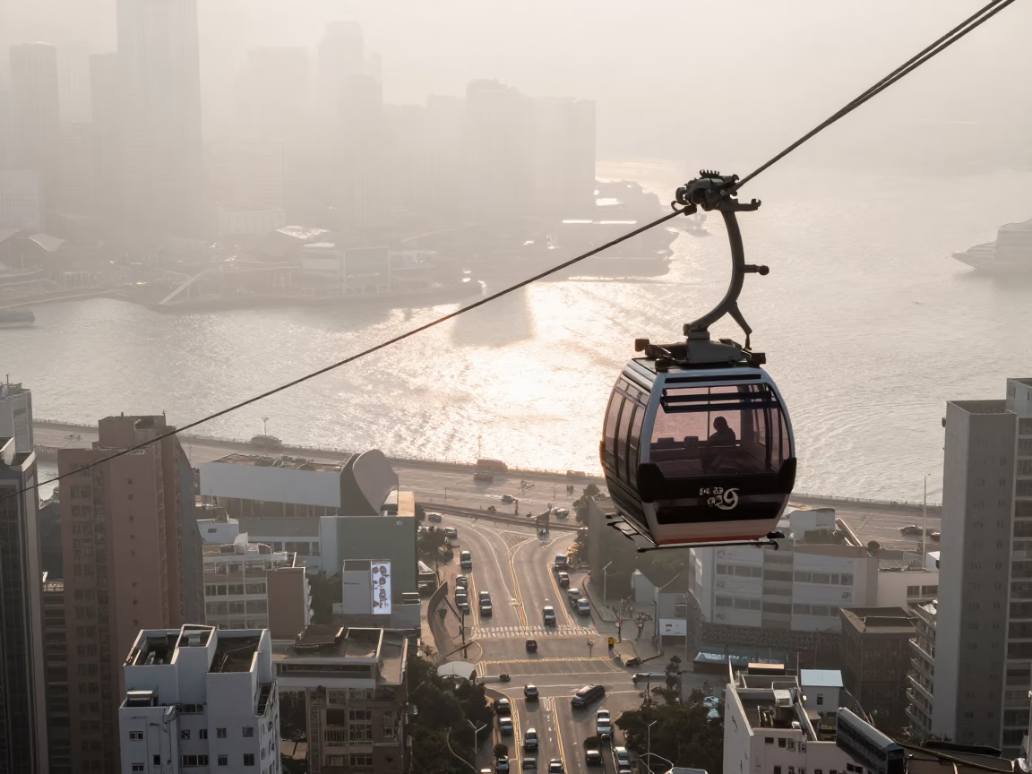 Morning Street Life in Hong Kong with Aerial Tramway Gondola Above Morning Fog in in Hong Kong, Hong Kong
