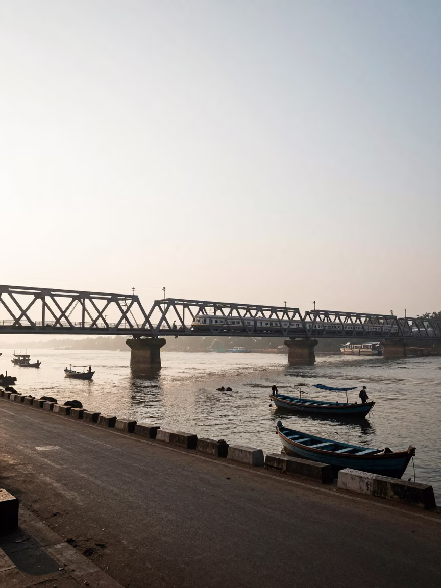 Morning Street Scene in Kochi India with Commuter Train Crossing Bridge at Sunrise in in Kochi, India