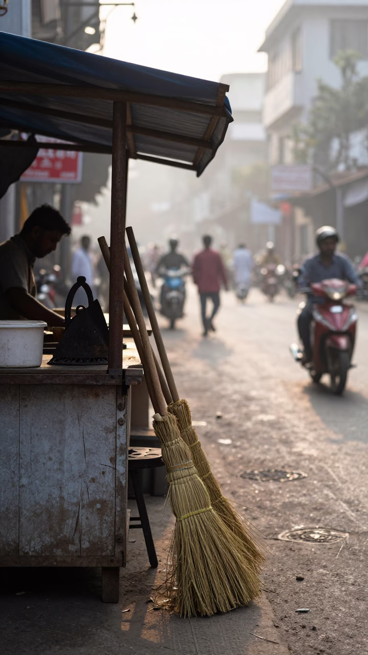 Morning Street Vendor Scene in Kolkata India with Brooms and Iron Hook in in Kolkata, India
