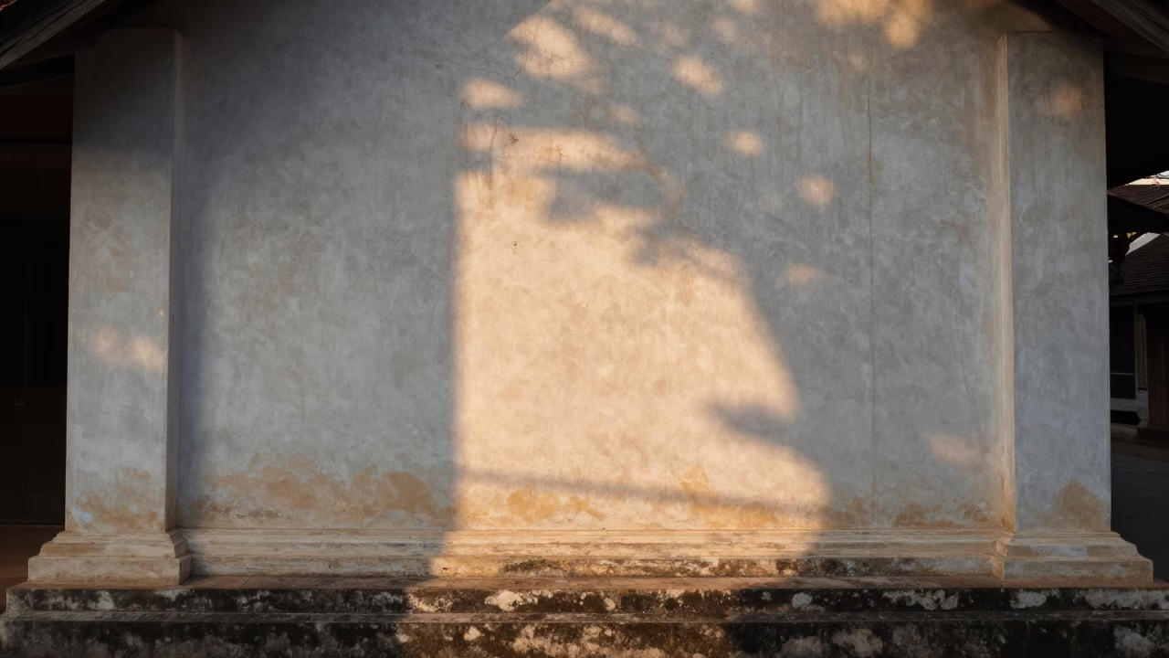 Morning Sunlight on Plaster Wall in Luang Prabang Laos with Local Life in in Luang Prabang, Laos