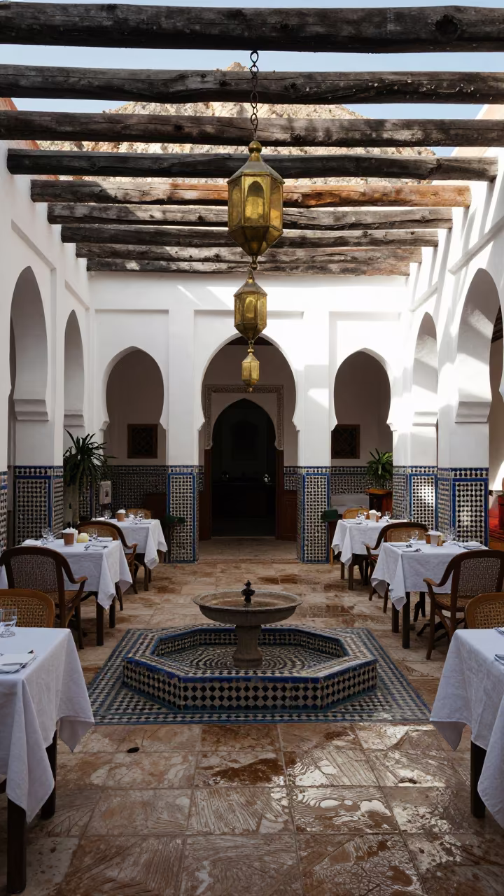 Moroccan Lantern Gallery Above Tile Fountain Courtyard in in a courtyard prepared for breakfast service in Mouassine, Marrakech