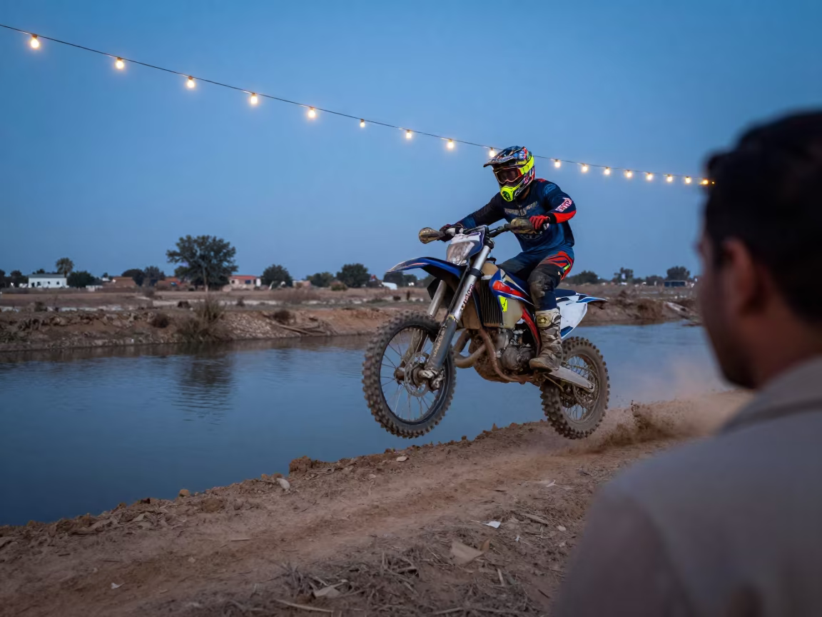 Motocross Rider Scrubbing Jump by Canal in beside a canal in Sialkot