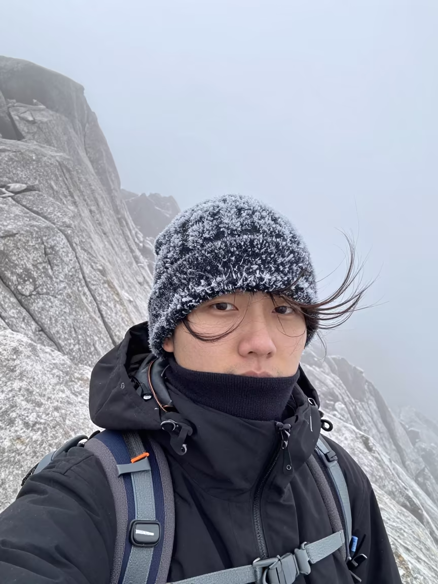 Mountain Guide Portrait in Winter Fog in beside a canal in Tbilisi