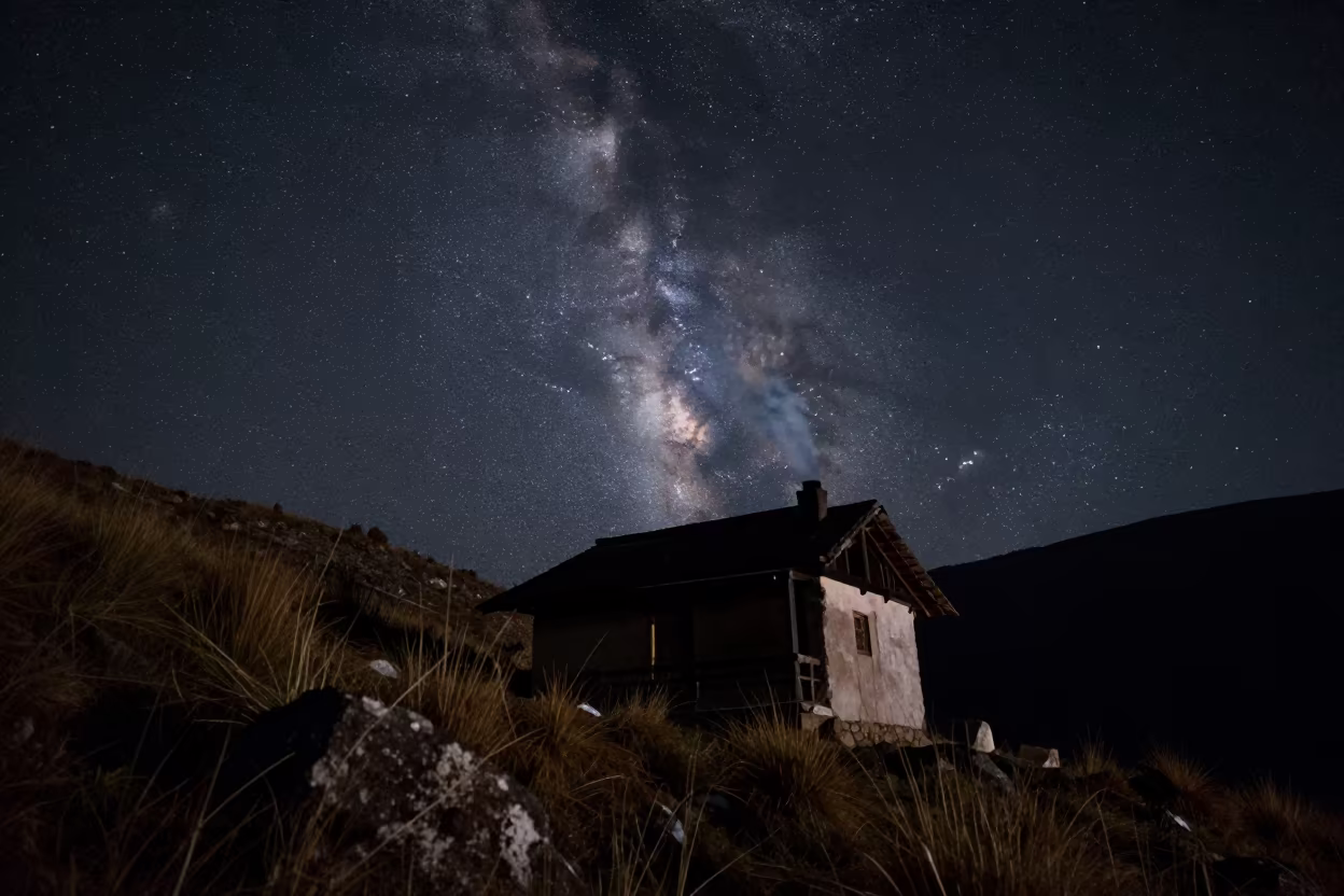 Mountain Hut Chimney Smoke Under Milky Way in from a quiet alpine saddle near Quito