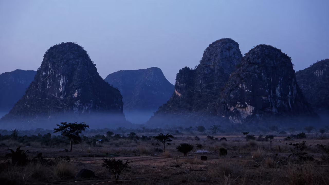 Mozambique Karst Towers Indigo Twilight Mist in across a wide valley floor in Mozambique